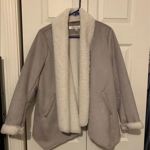 Fly away style, open front, faux shearling jacket.    Soft inside and out.